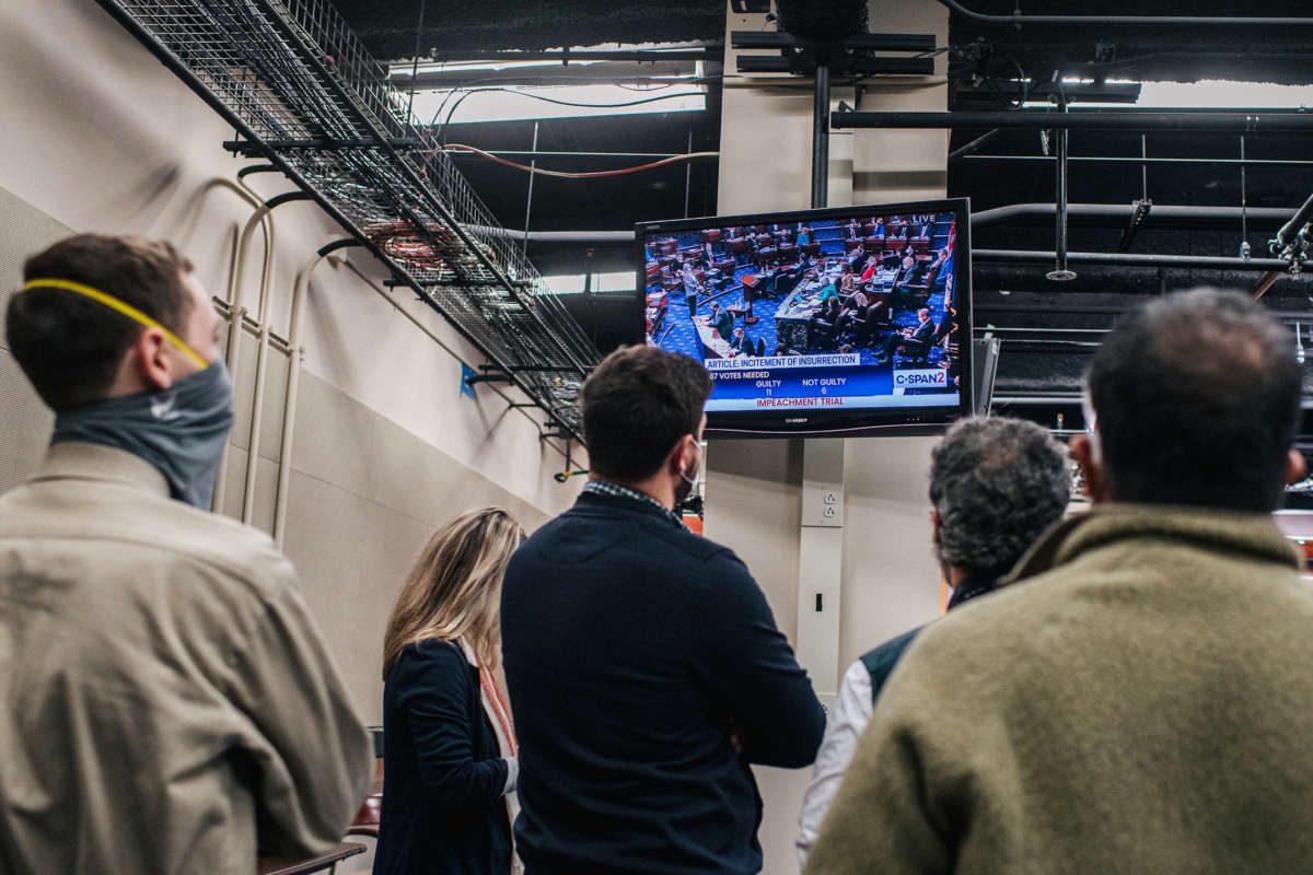 People watch the impeachment coverage