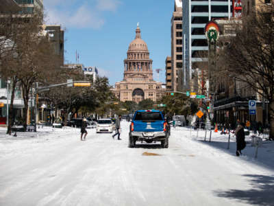 The Texas Capitol building is surrounded by snow on February 15, 2021.