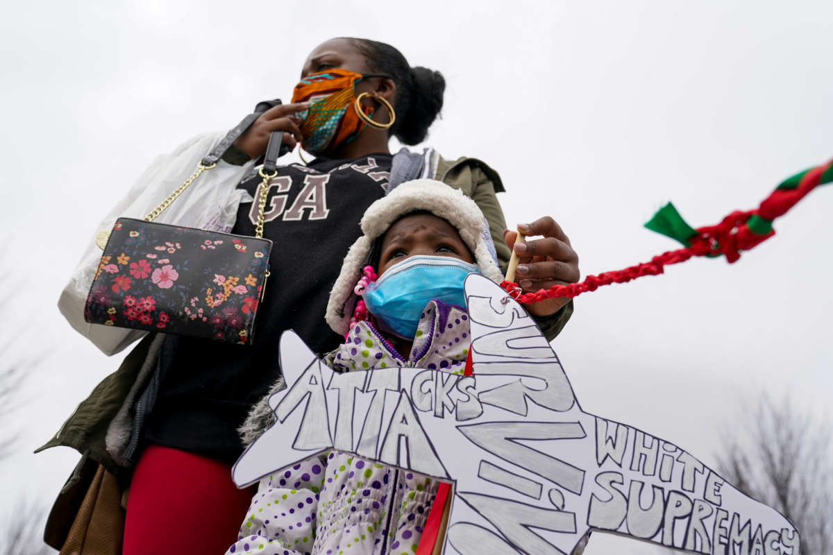 Allies of Black immigrants gather at the Martin Luther King Jr. Memorial to remember the Black immigrants who have been deported, on February 10, 2021, in Washington, D.C.