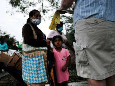 Food is distributed during a mobile food pantry on February 16, 2021, in Immokalee, Florida.