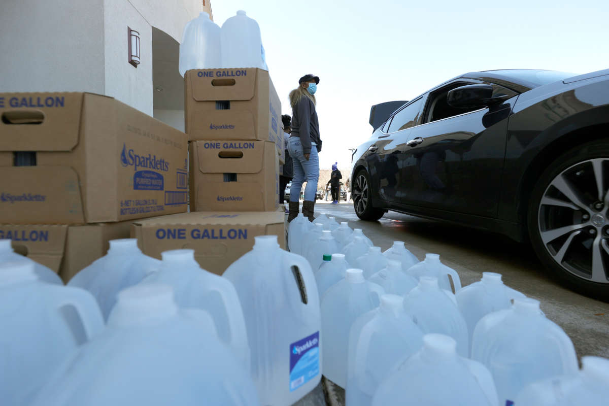 Volunteers prepare to hand out water during a water distribution event at the Fountain Life Center on February 20, 2021, in Houston, Texas.