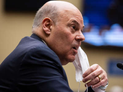 United States Postal Service Postmaster General Louis DeJoy speaks during a House Oversight and Reform Committee hearing on February 24, 2021, on Capitol Hill in Washington, D.C.