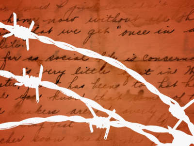 Barbed wire over a handwritten letter, mail