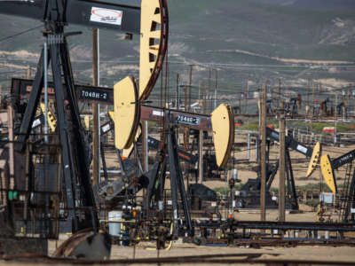 Oil pipelines, pumping rigs, and electrical transmission lines dot the landscape along California's "Petroleum Highway" (Highway 33) running along the northwestern side of the San Joaquin Valley on April 24, 2020, near McKittrick, California.