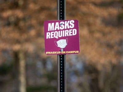 A sign alerting people that masks are required on campus seen at Bloomsburg University, in Bloomsberg, Pennsylvania, on February 6, 2021.