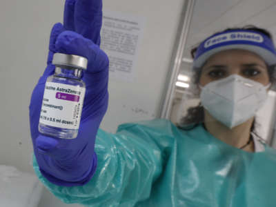 A nurse shows the AstraZeneca vaccine used at the "Covid Express" vaccination centre at Son Dureta Hospital in Palma, Spain, on February 27, 2021.