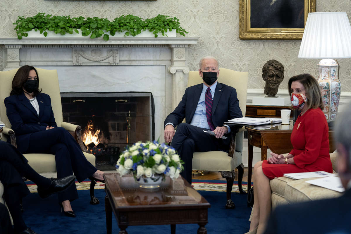 President Joe Biden and Vice President Kamala Harris meet with House Democratic leaders, including Speaker of the House Nancy Pelosi, and committee chairs to discuss the coronavirus relief legislation in the Oval Office at the White House February 5, 2021, in Washington, D.C.