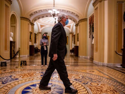 Senate Minority Leader Mitch McConnell (R-Kentucky) walks out the Senate chamber in the U.S. Capitol on February 12, 2021, in Washington, D.C. Trump's defense team presented the defense that Trump should not be held responsible for the January 6th attack at the U.S. Capitol on First Amendment grounds and the fact that he is no longer in office.