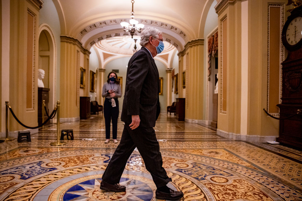Senate Minority Leader Mitch McConnell (R-Kentucky) walks out the Senate chamber in the U.S. Capitol on February 12, 2021, in Washington, D.C. Trump's defense team presented the defense that Trump should not be held responsible for the January 6th attack at the U.S. Capitol on First Amendment grounds and the fact that he is no longer in office.
