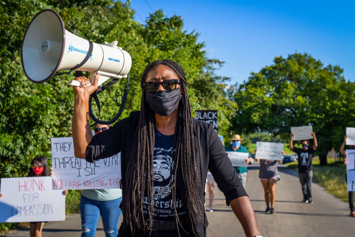 Protesters organized by the Campaign to Fight Toxic Prisons and the National Council call attention to the conditions at FMC Carswell, the only federal medical prison for women, on August 1, 2020, in Fort Worth, Texas.