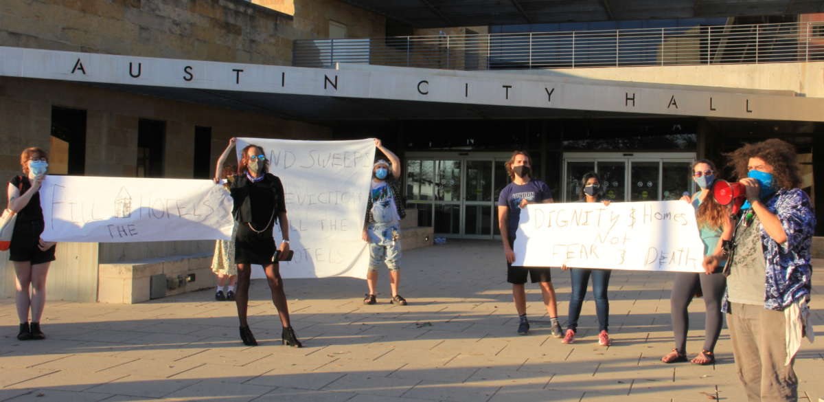 Organizers with Stop the Sweeps and The Challenger newspaper protest for housing rights outside Austin City Hall in Austin, Texas, on February 21, 2021, after winter storm Uri that plunged those on the streets into sub-freezing temperatures.