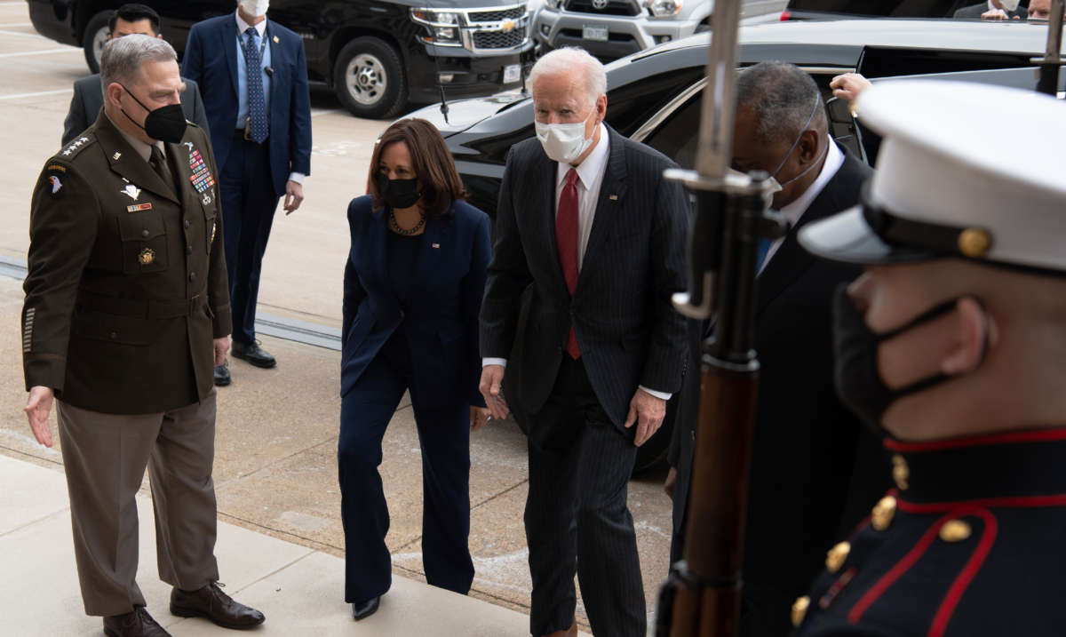 President Joe Biden walks alongside Vice President Kamala Harris, Chairman of the Joint Chiefs Mark Miller and Secretary of Defense Lloyd Austin as he arrives at the Pentagon in Washington, D.C., on February 10, 2021.