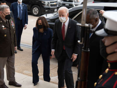 President Joe Biden walks alongside Vice President Kamala Harris, Chairman of the Joint Chiefs Mark Miller and Secretary of Defense Lloyd Austin as he arrives at the Pentagon in Washington, D.C., on February 10, 2021.