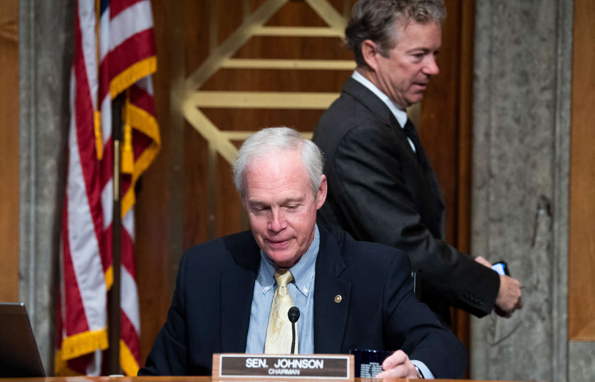 Sens. Ron Johnson and Rand Paul arrive at Dirksen Building on December 8, 2020.