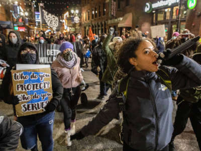 MC Jordan Weber leads a Detroit Will Breathe protest march in chants in favor of Black Lives throughout downtown Detroit on November 13, 2020.