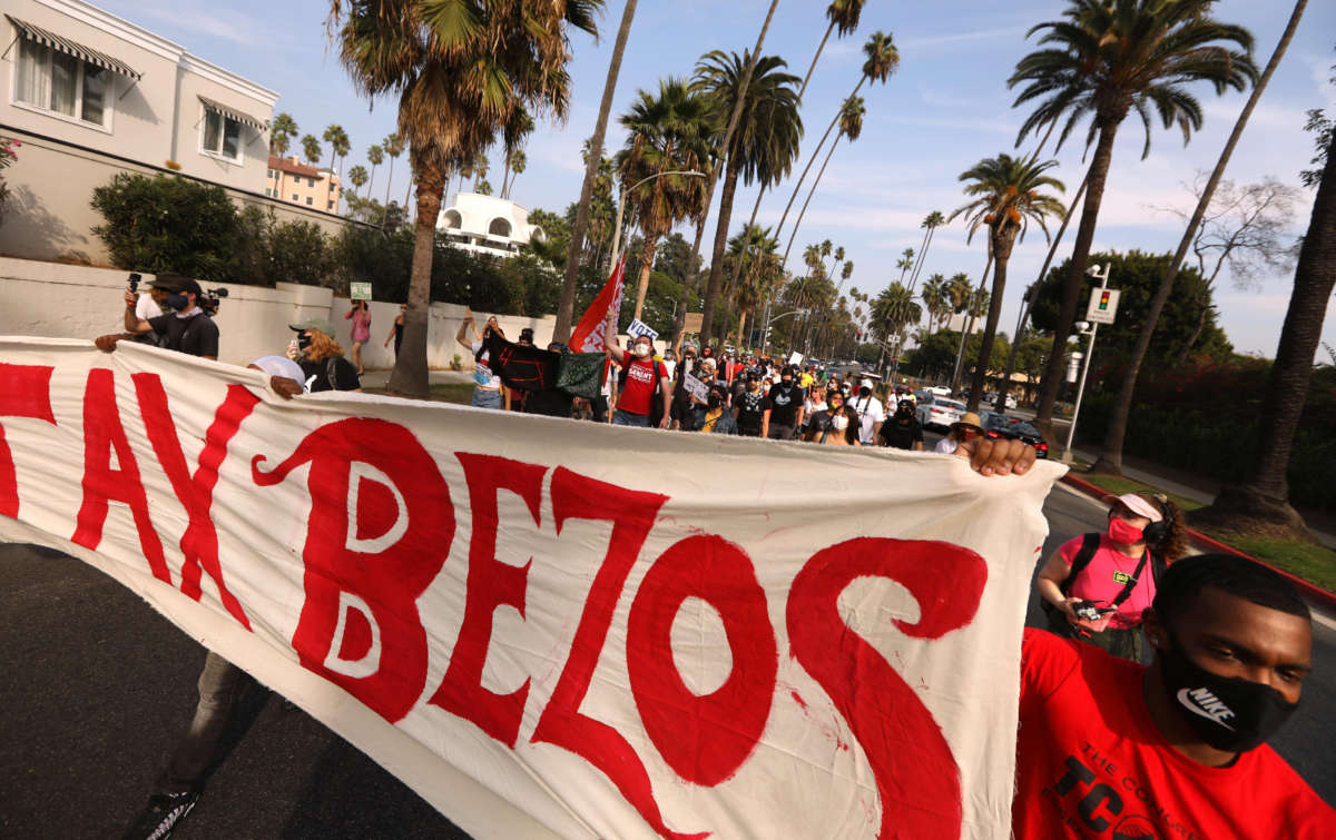 Hundreds march to Amazon founder Jeff Bezos' mansion to lobby for higher wages, the right to unionize and a series of reforms in the way the giant company handles the COVID-19 crisis in Beverly Hills, California, on October 4, 2020.