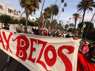 Hundreds march to Amazon founder Jeff Bezos' mansion to lobby for higher wages, the right to unionize and a series of reforms in the way the giant company handles the COVID-19 crisis in Beverly Hills, California, on October 4, 2020.