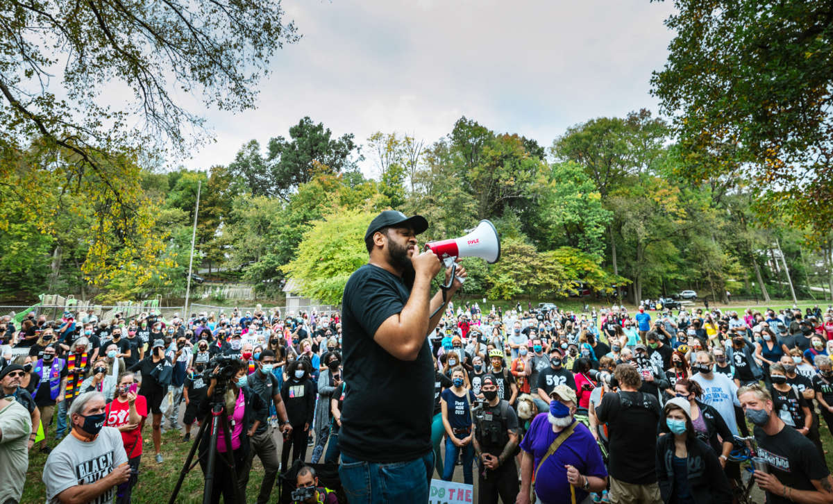 Rep. Charles Booker speaks to protesters gathering before a march to the Breonna Taylor memorial at Jefferson Square Park on October 10, 2020, in Louisville, Kentucky.