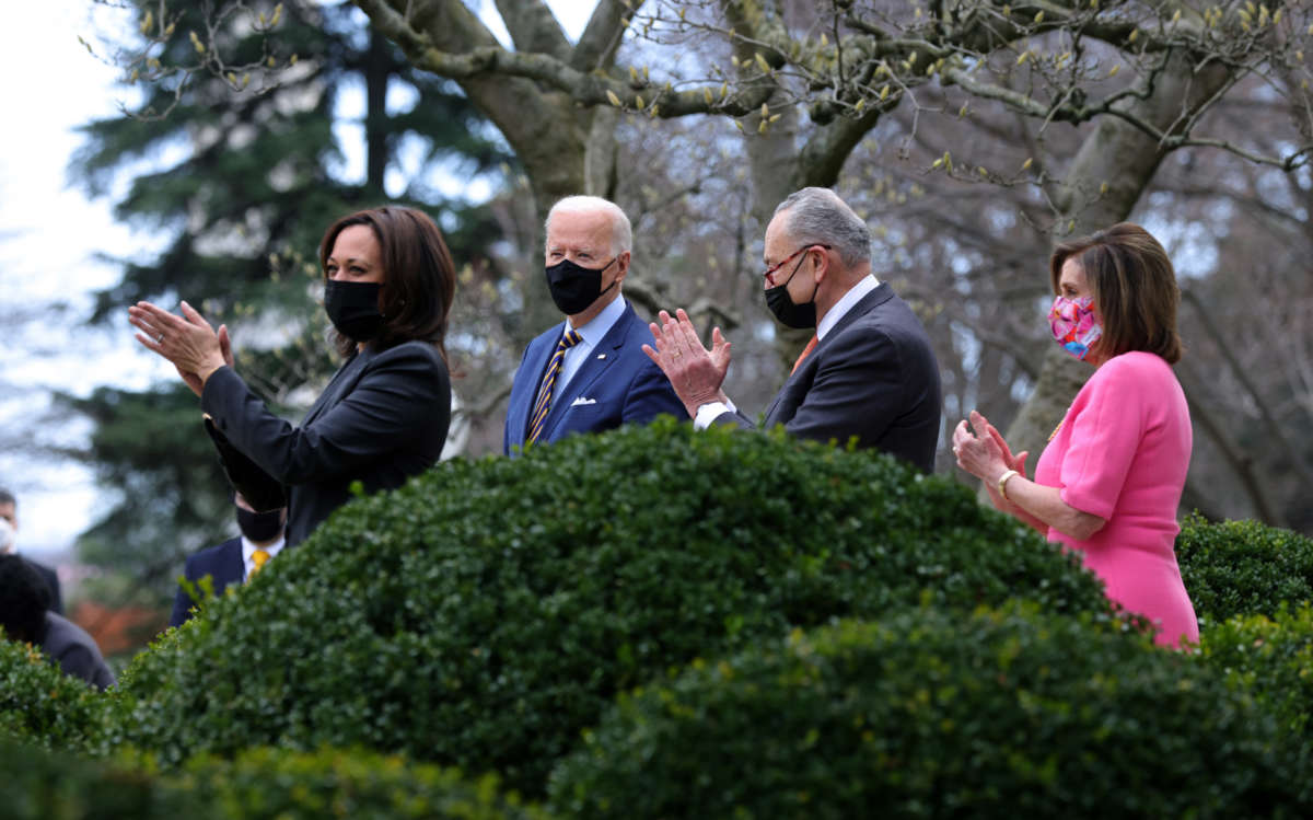 Vice President Kamala Harris, President Joe Biden, Senate Majority Leader Sen. Chuck Schumer and Speaker of the House Rep. Nancy Pelosi attend an event on the American Rescue Plan in the Rose Garden of the White House on March 12, 2021, in Washington, D.C.