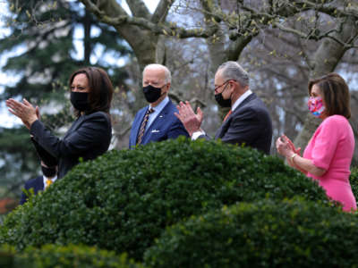 Vice President Kamala Harris, President Joe Biden, Senate Majority Leader Sen. Chuck Schumer and Speaker of the House Rep. Nancy Pelosi attend an event on the American Rescue Plan in the Rose Garden of the White House on March 12, 2021, in Washington, D.C.