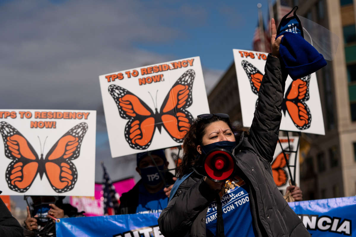 Activists and citizens with temporary protected status (TPS) march along 16th Street toward the White House in a call for Congress and the Biden administration to pass immigration reform legislation on February 23, 2021, in Washington, D.C.