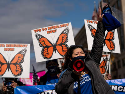 Activists and citizens with temporary protected status (TPS) march along 16th Street toward the White House in a call for Congress and the Biden administration to pass immigration reform legislation on February 23, 2021, in Washington, D.C.