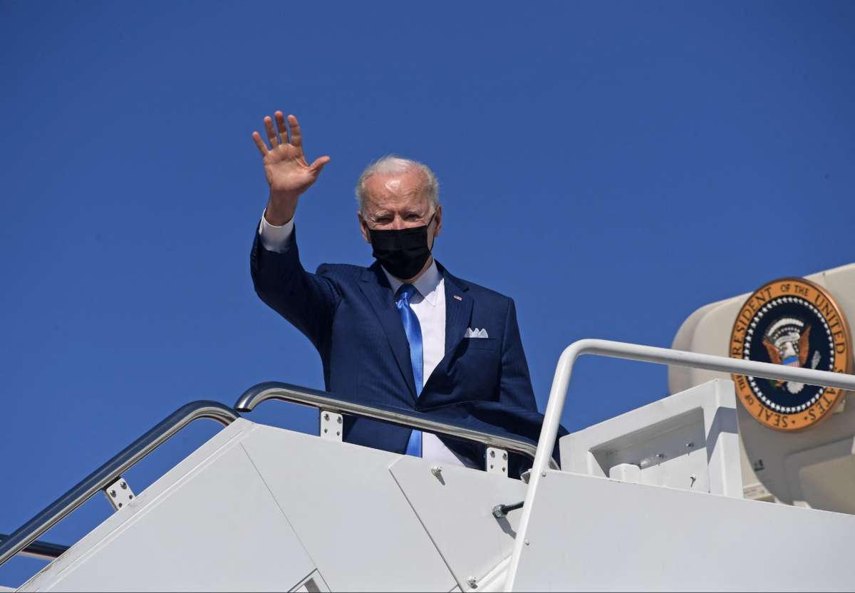 Joseph Robinette Biden waves to the press from the steps of Air Force One