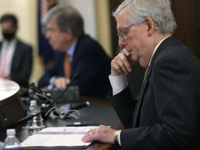 Senate Minority Leader Mitch McConnell listens during a Senate Rules and Administration Committee hearing on the For the People Act on March 24, 2021, in Washington, D.C.