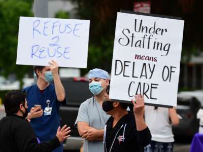 Nurses stage a protest with support from the registered nurses union, SEIU Local 121RN, outside the West Hills Hospital on June 18, 2020, in West Hills, California.