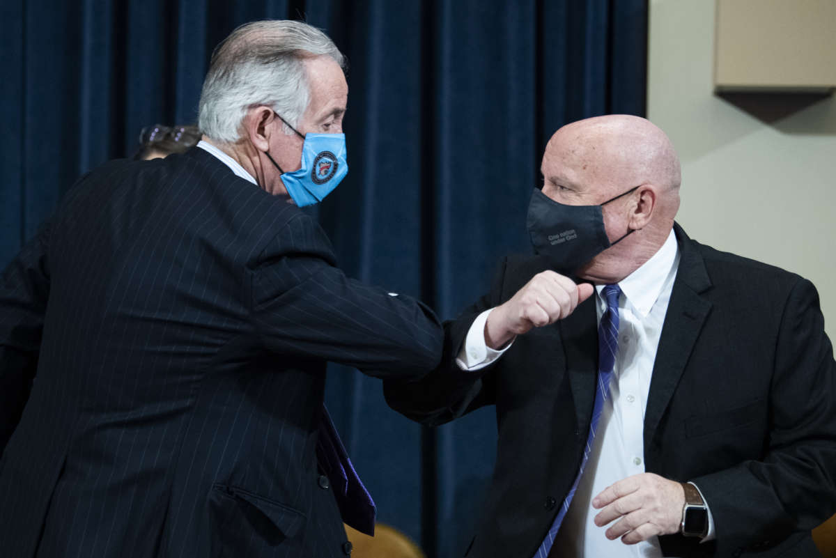 House Ways and Means Chairman Richard Neal, a Democrat, and ranking member Rep. Kevin Brady, a Republican, bump arms in the Longworth Building on February 10, 2021.