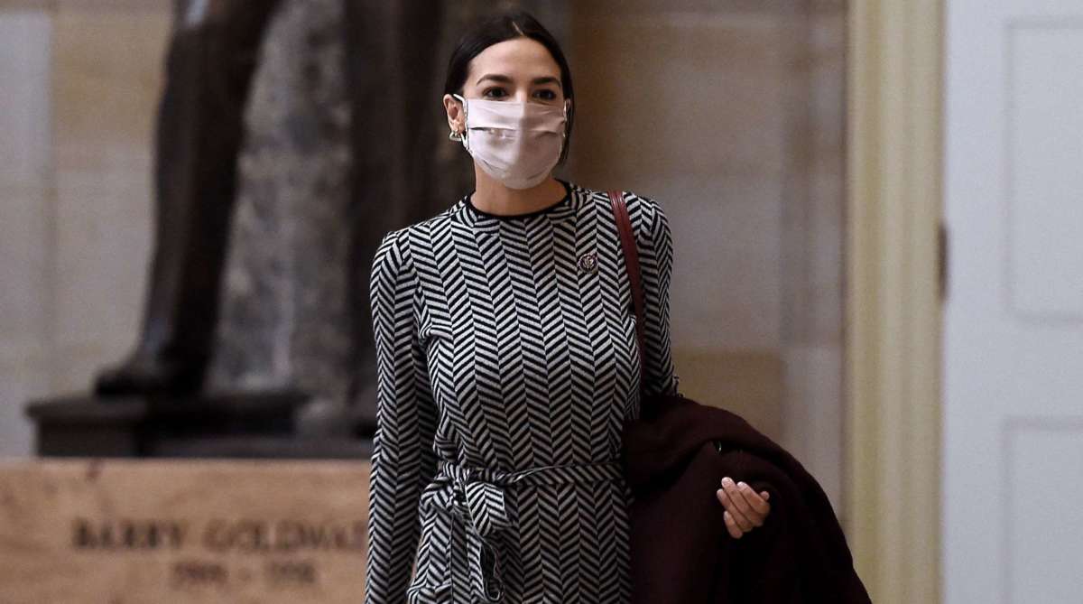 Rep. Alexandria Ocasio-Cortez walks to the House floor on Capitol Hill on March 10, 2021, in Washington, D.C.