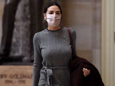 Rep. Alexandria Ocasio-Cortez walks to the House floor on Capitol Hill on March 10, 2021, in Washington, D.C.