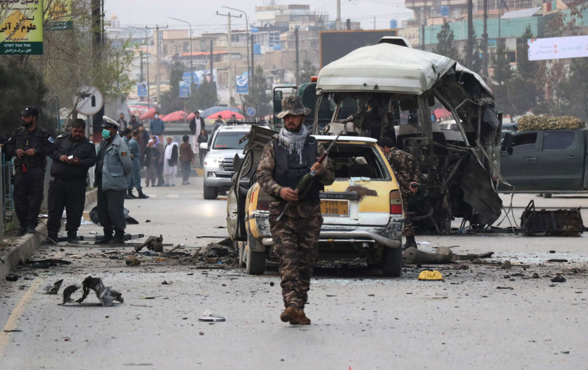 Afghan security official inspect the scene of a blast in Kabul, Afghanistan, on March 15, 2021.