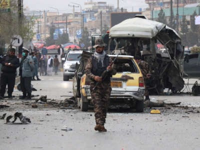 Afghan security official inspect the scene of a blast in Kabul, Afghanistan, on March 15, 2021.