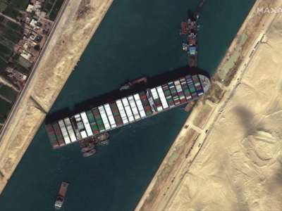 The container ship Ever Given remains stuck in the canal north of the city of Suez, Egypt, on March 27, 2021.