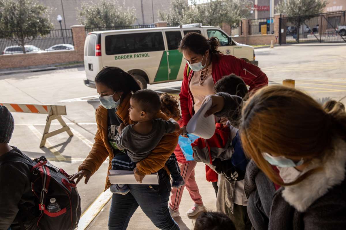 A family of Central American asylum seekers arrives to a bus station after being dropped off by U.S. Border Patrol agents on February 25, 2021, in Brownsville, Texas.