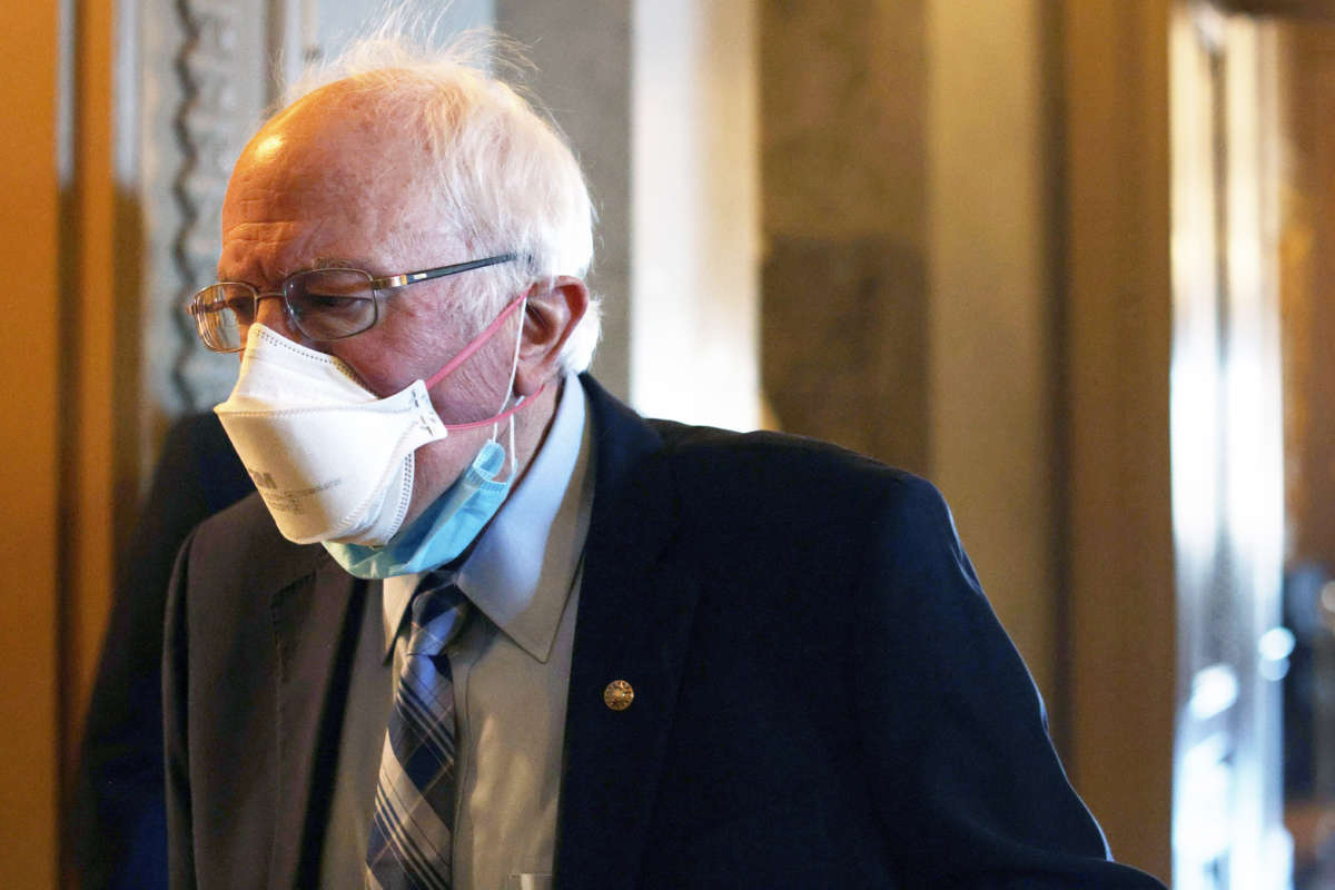 Sen. Bernie Sanders passes through a hallway at the U.S. Capitol March 5, 2021, in Washington, D.C.