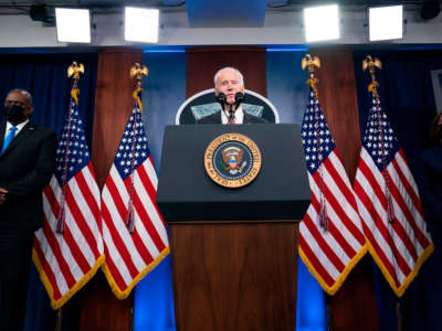 President Joe Biden speaks as Secretary of Defense Lloyd Austin and Vice President Kamala Harris accompany him at the Pentagon, February 10, 2021, in Washington, D.C.