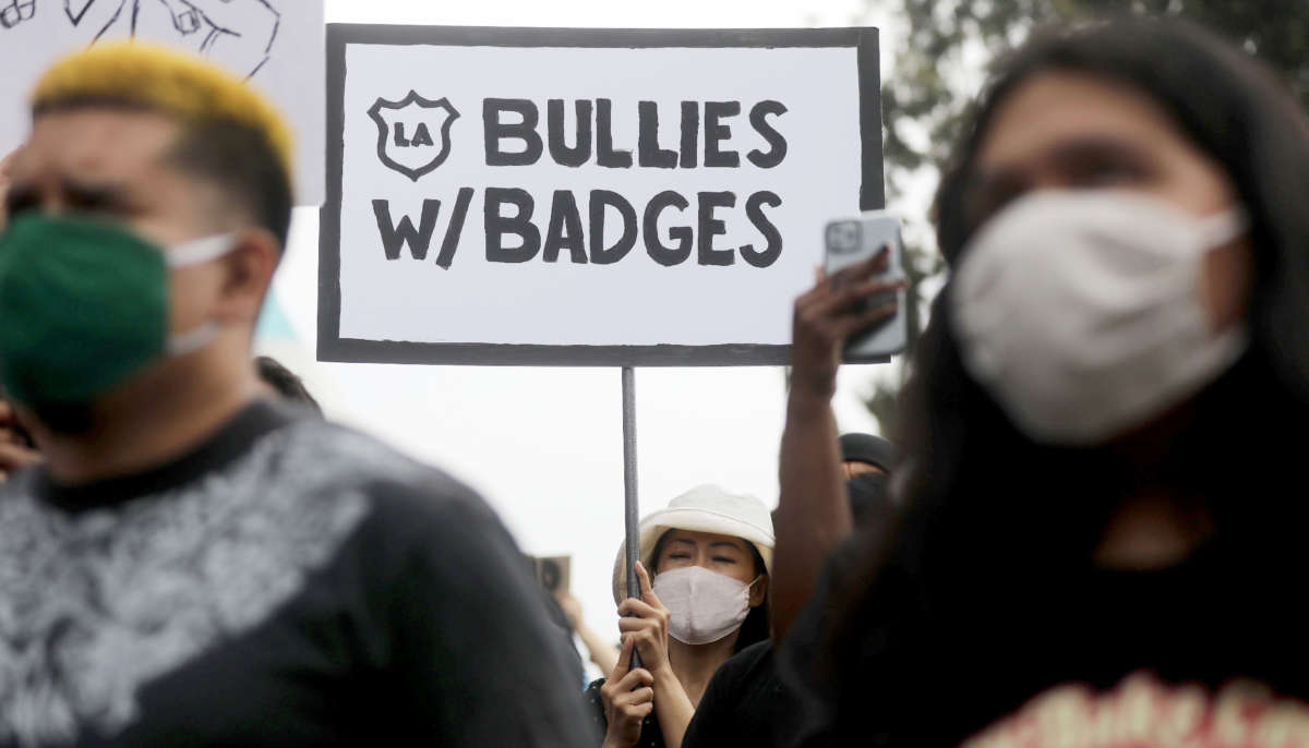 Protesters outside the Unified School District headquarters call on the board of education to defund school police on June 23, 2020, in Los Angeles, California.