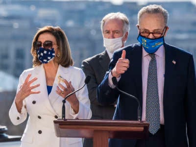 Speaker of the House Nancy Pelosi (D-California), Rep. Richard Neal (D-Massachusetts) and Senate Majority Leader Chuck Schumer (D-New York) attend a bill enrollment ceremony for the American Rescue Plan Act after the House passed the package on Wednesday, March 10, 2021.