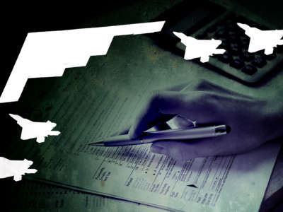 Silhouettes of fighter jets over a hand filing tax forms