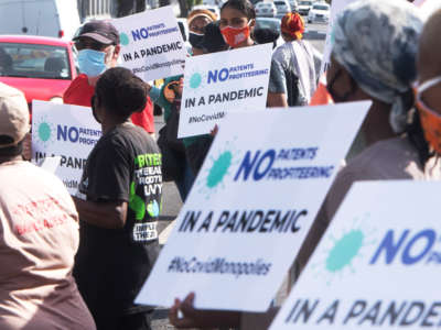 Protesters picket outside Johnson & Johnson offices during the "Global Day of Action for a People's Vaccine" on March 11, 2021, in Cape Town, South Africa.