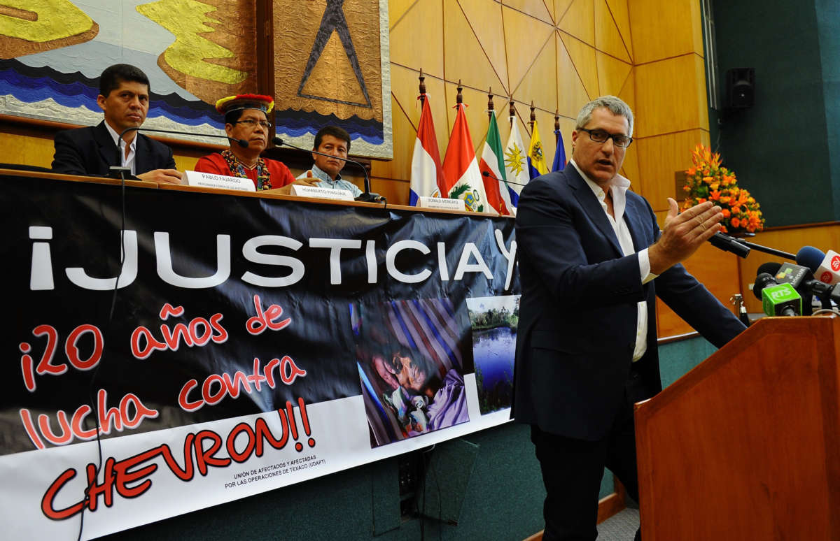 The lawyer of Ecuadorean people affected by Texaco-Chevron -- who have long sought compensation for pollution between the 1970s and early 1990s -- Steven Donziger, gestures during a press conference on March 19, 2014, in Quito.