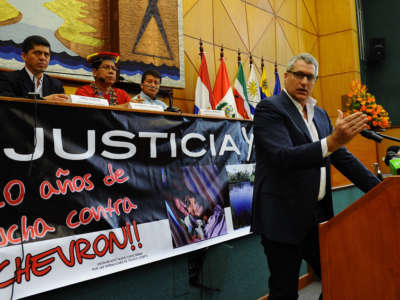 The lawyer of Ecuadorean people affected by Texaco-Chevron -- who have long sought compensation for pollution between the 1970s and early 1990s -- Steven Donziger, gestures during a press conference on March 19, 2014, in Quito.