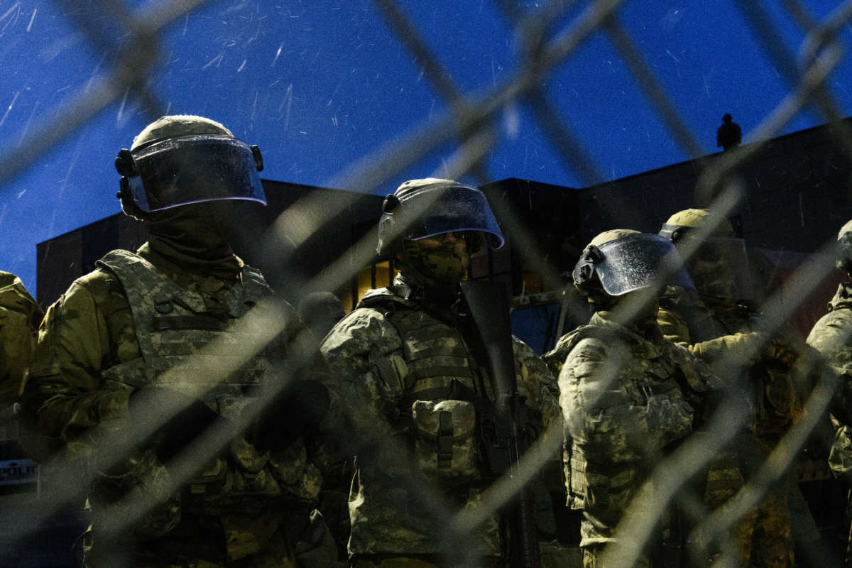 Members of the Minnesota National Guard stand guard outside the Brooklyn Center police headquarters as protesters gather on April 13, 2021, in Brooklyn Center, Minnesota.