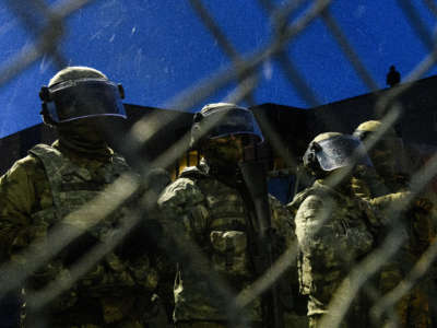 Members of the Minnesota National Guard stand guard outside the Brooklyn Center police headquarters as protesters gather on April 13, 2021, in Brooklyn Center, Minnesota.