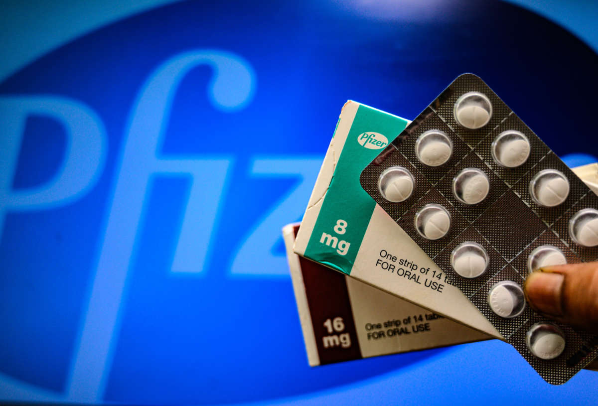 Medicine pills are seen with Pfizer logo in this illustration photo taken in Tehatta, West Bengal, India, on April 29, 2021.