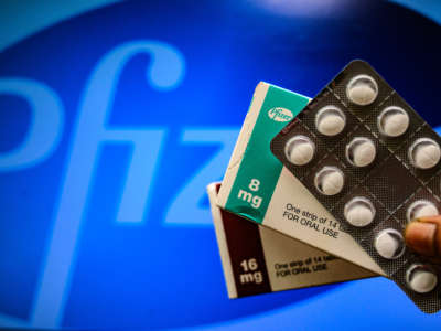 Medicine pills are seen with Pfizer logo in this illustration photo taken in Tehatta, West Bengal, India, on April 29, 2021.