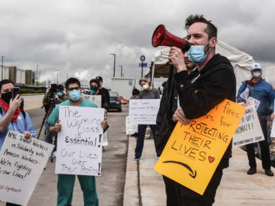 People protest working conditions outside of an Amazon warehouse fulfillment center on May 1, 2020, in the Staten Island borough of New York City.