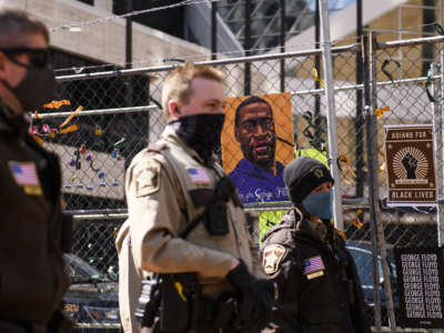 Law enforcement stands guard outside the Hennepin County Government Center, as the trial of former Minneapolis police officer Derek Chauvin continues inside, on April 2, 2021, in Minneapolis, Minnesota.